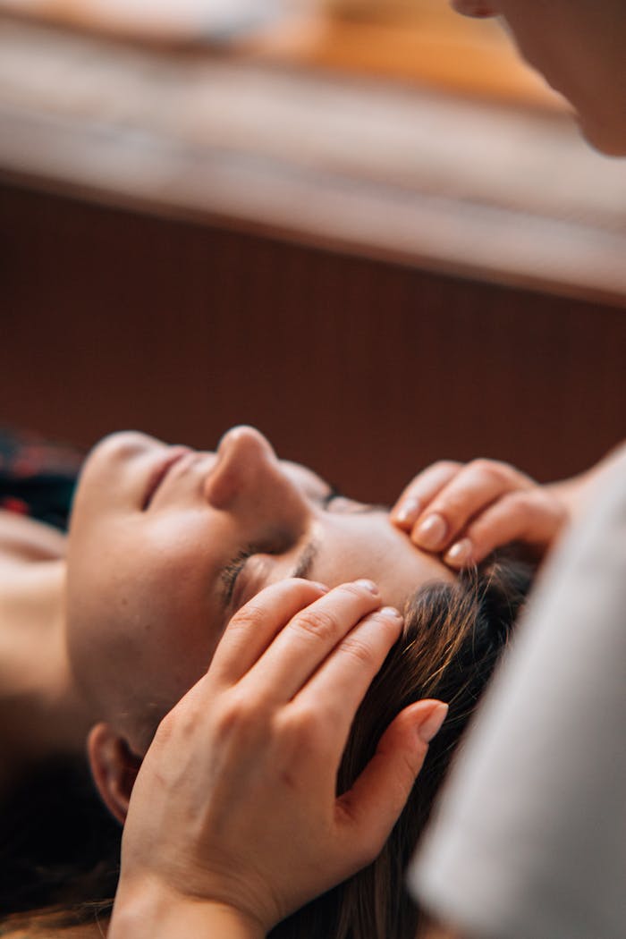 Close-up of a woman receiving a soothing massage at a spa for complete relaxation.